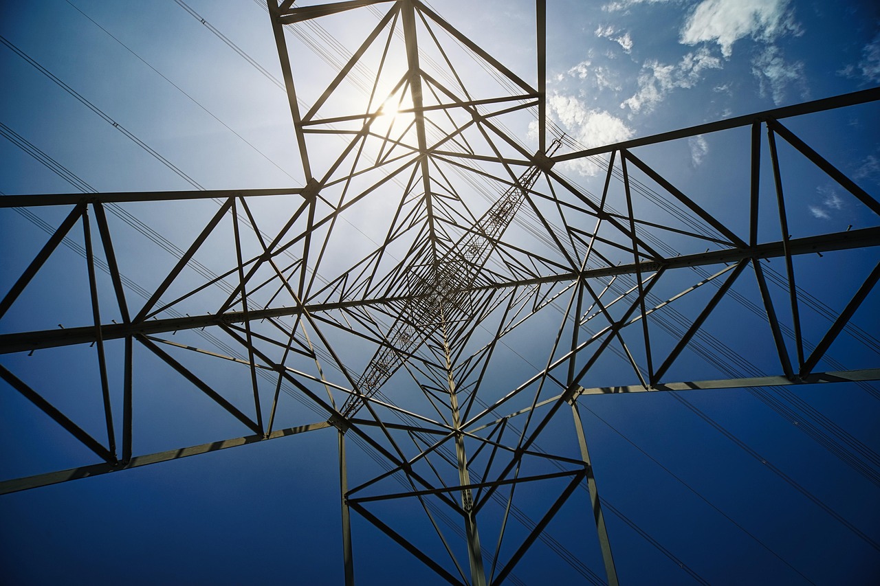 pylon electricity sun power grid infrastructure industrial landscape sky nature cloudscape perspective height scale